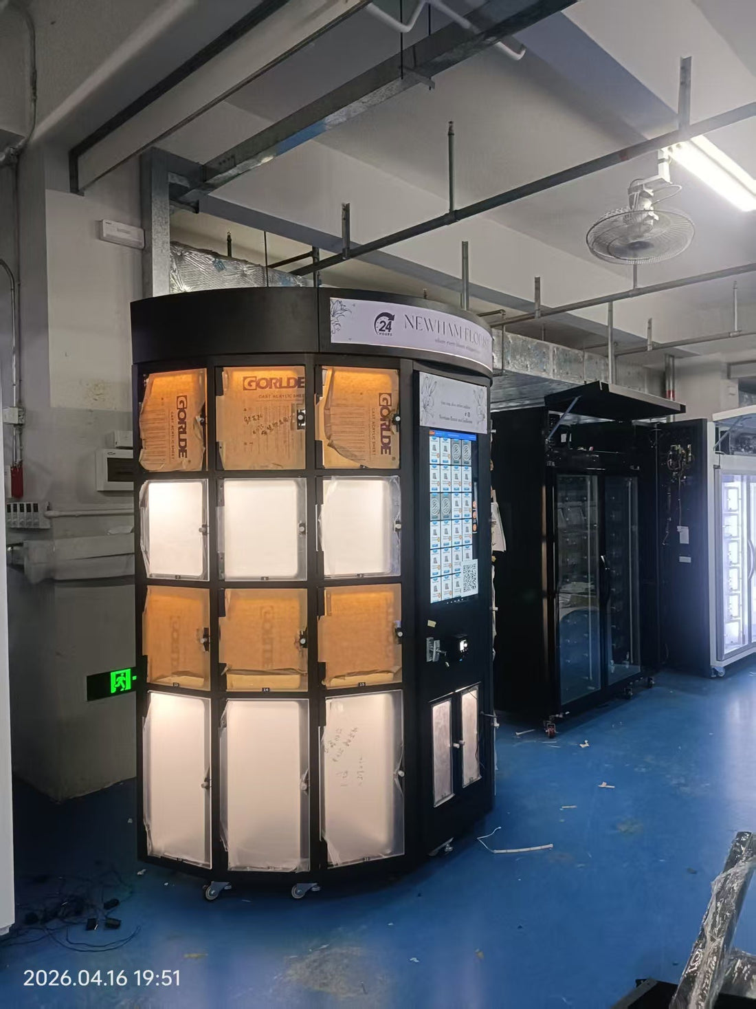 Row of brand-new WEIMI flower vending machines fresh from the factory with vibrant fresh bouquets, WEIMI orange logo naturally in top-left corner, representing 2026 factory direct best deals and OEM/ODM opportunities.